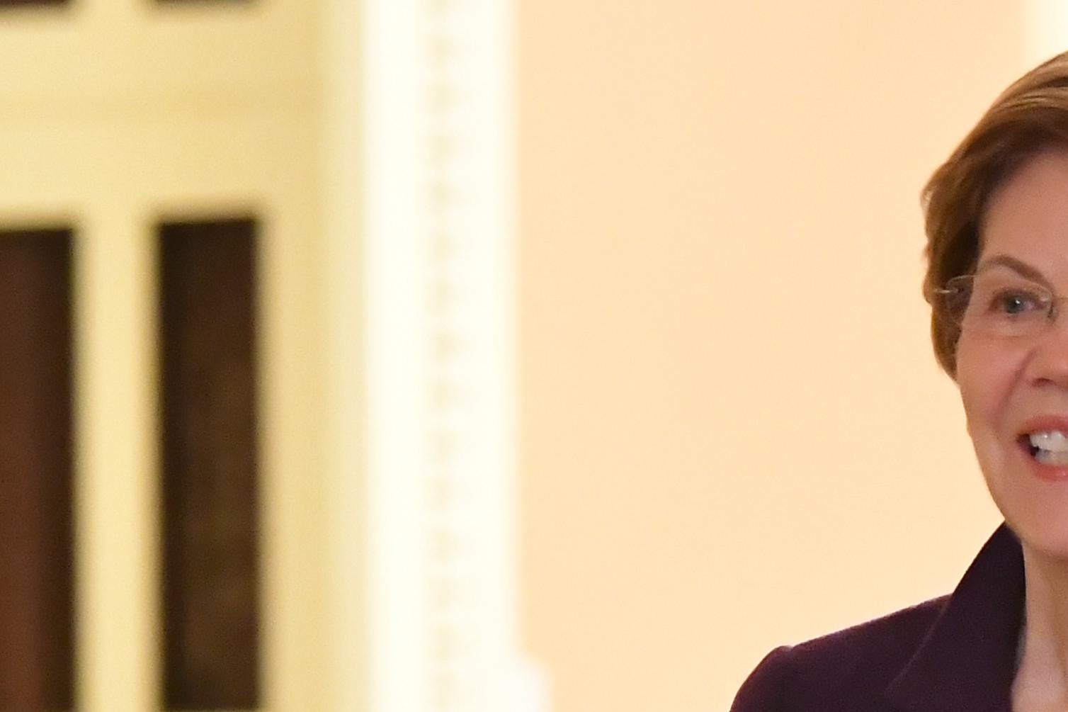 Elizabeth Warren walks through the Senate halls