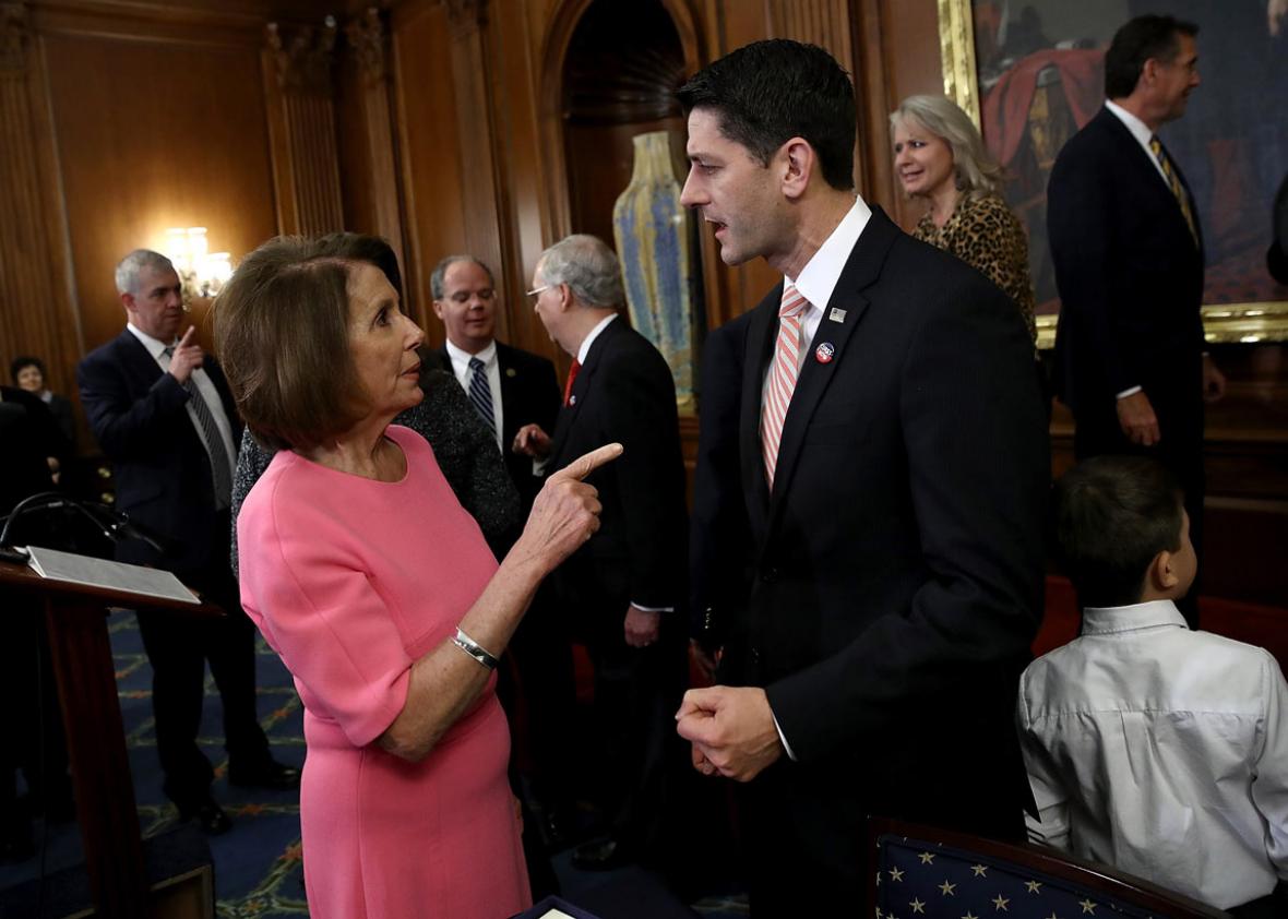 U.S. Speaker of the House Paul Ryan (R) (R-WI) speaks with House Minority Leader Rep. Nancy Pelosi (D-CA)