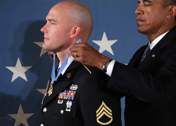 President Obama (R) awards U.S. Army Staff Sergeant Ty M. Carter the Medal of Honor for conspicuous gallantry.