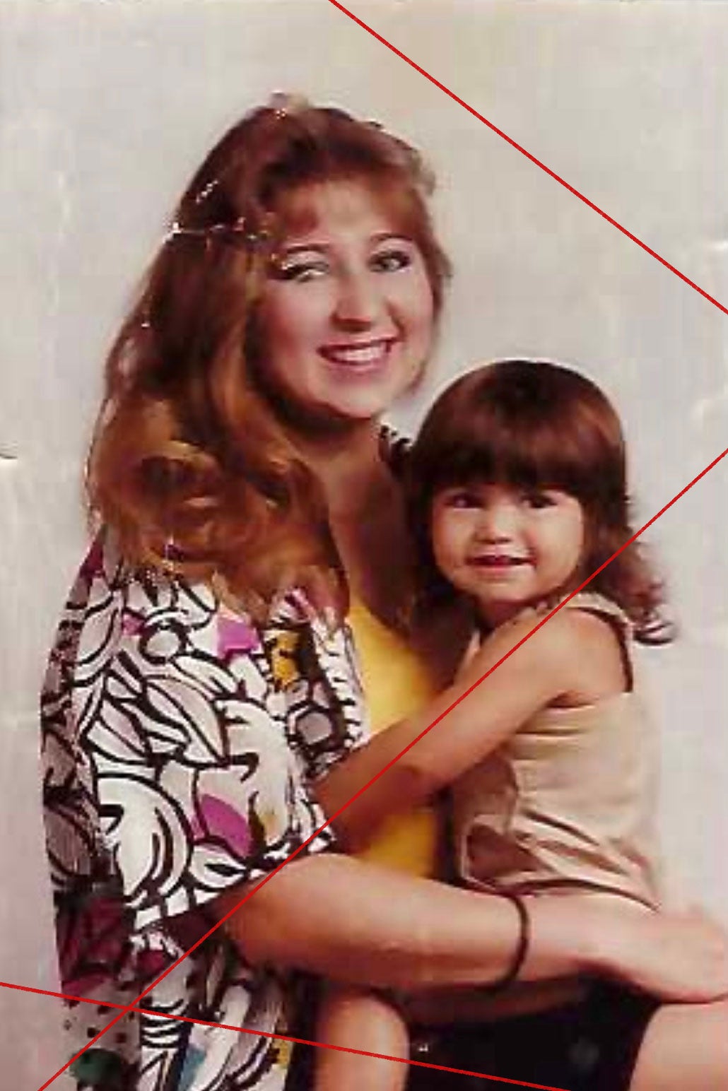 Late 1980s or early ’90s family photo of a 20-something woman with her daughter.