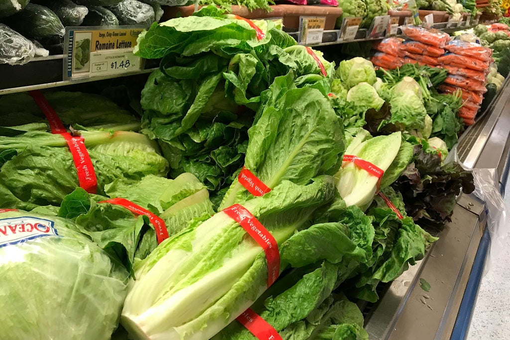 Piles of lettuce in a supermarket.