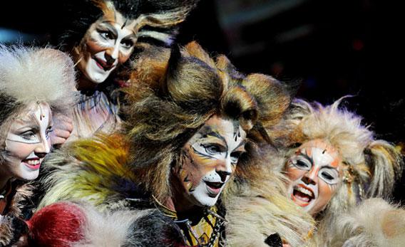 Cast member 'Rum Tum Tugger' (C) performs with others during a media call for the musical 'Cats'.