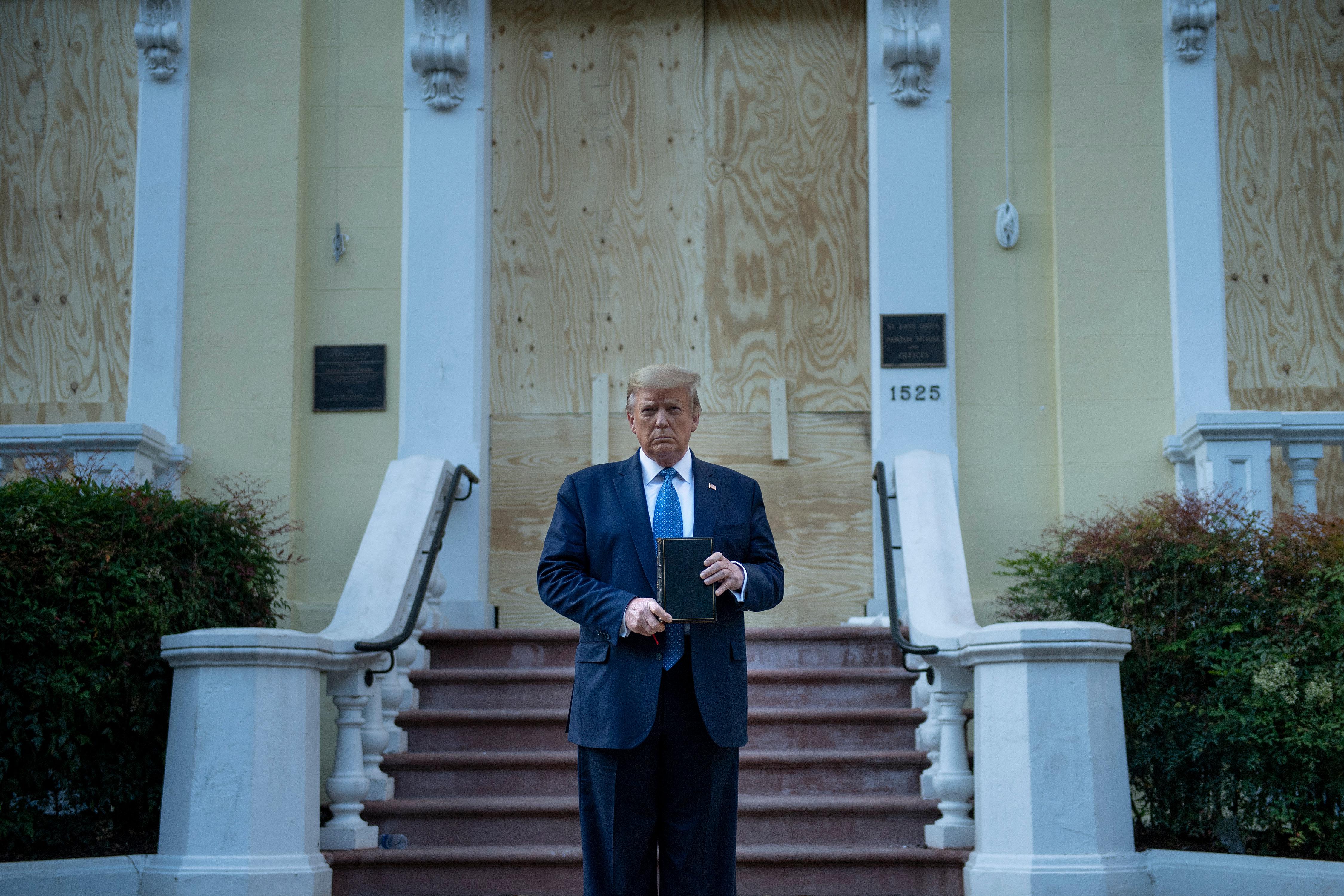 Trump holds a Bible in front of a boarded-up church