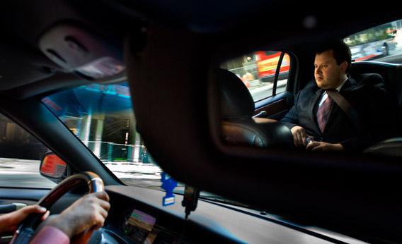 Brendan Kownacki rides in the UBER Car that he beckon via a smartphone app in Washington, DC on July 16, 2012.