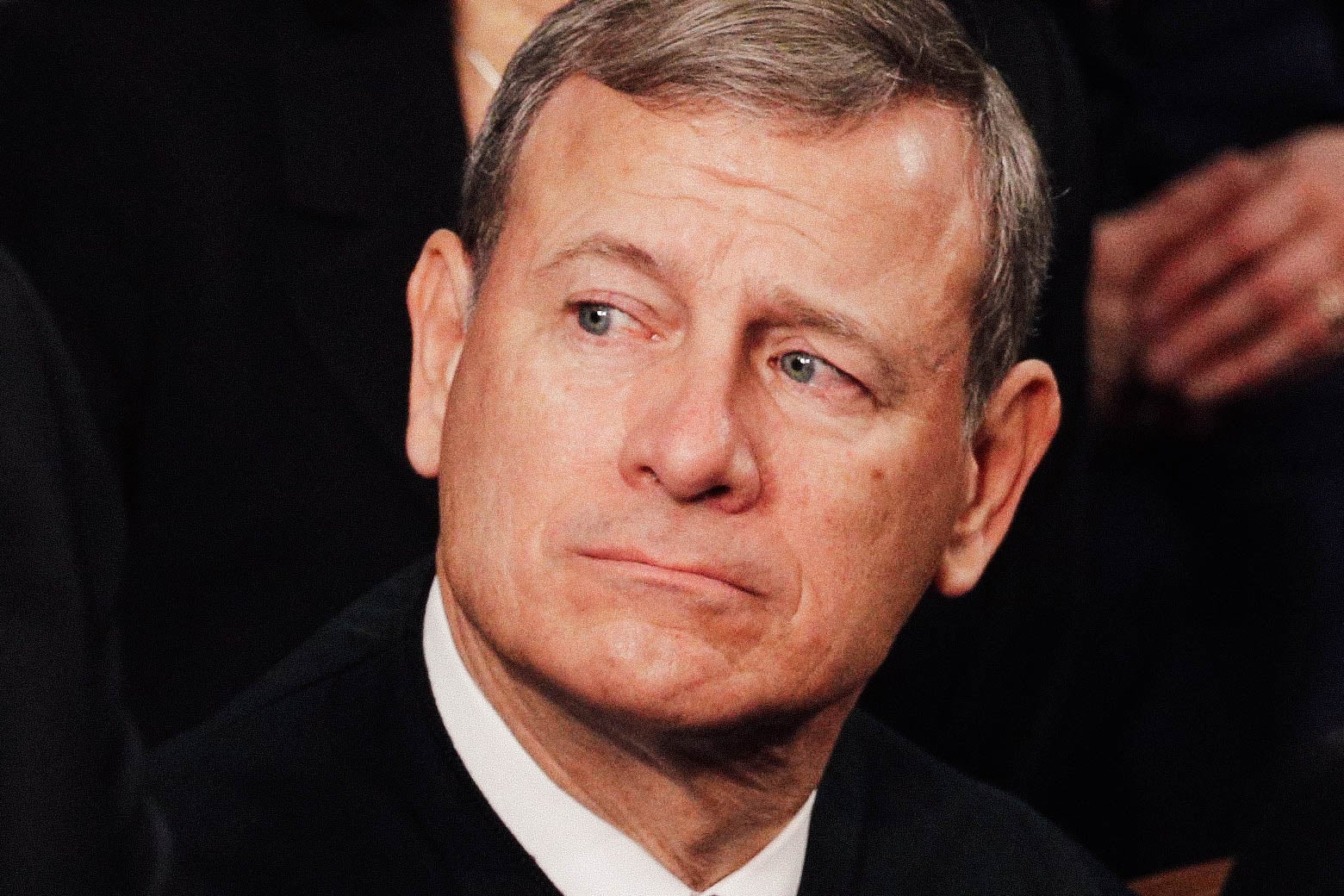 Chief Justice John Roberts looks on during the State of the Union address in the chamber of the House of Representative