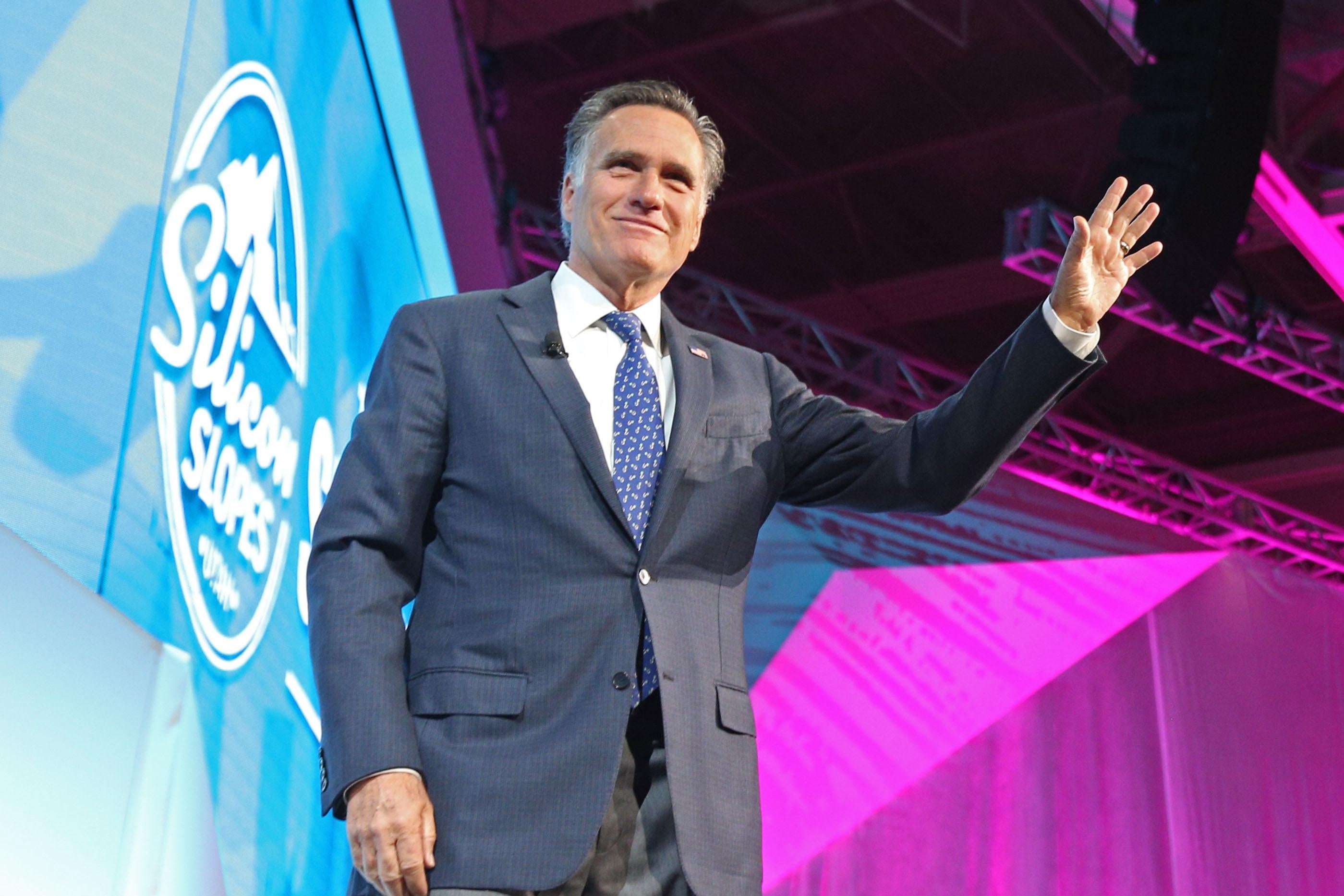 Mitt Romney waves as he leaves the stage at the Silicon Slopes Tech Conference in Salt Lake City, Utah.