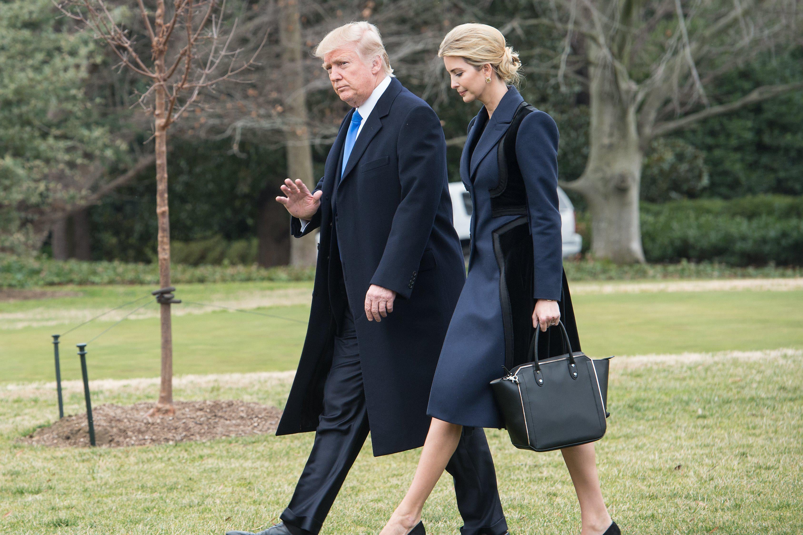 Donald and Ivanka Trump walk towards Marine One to board it.