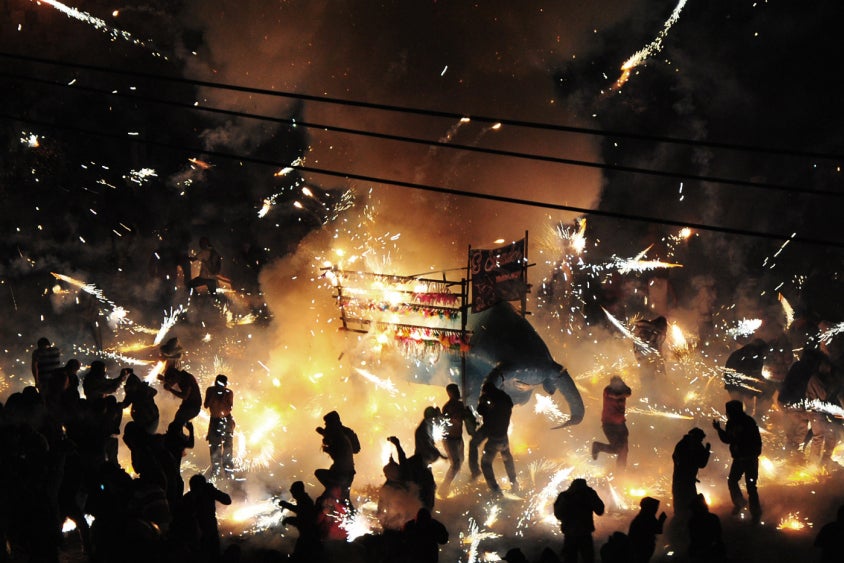 The people of Tultepec, Mexico dodge sparks during their annual pyrotechnics festival.