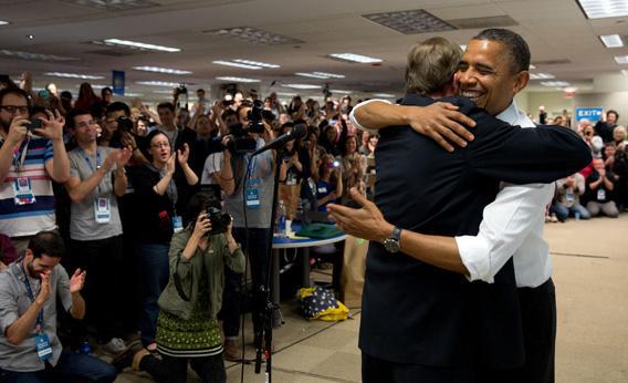 Pres. Obama bear hugs his campaign manager Jim Messina at campaign headquarters in Chicago.