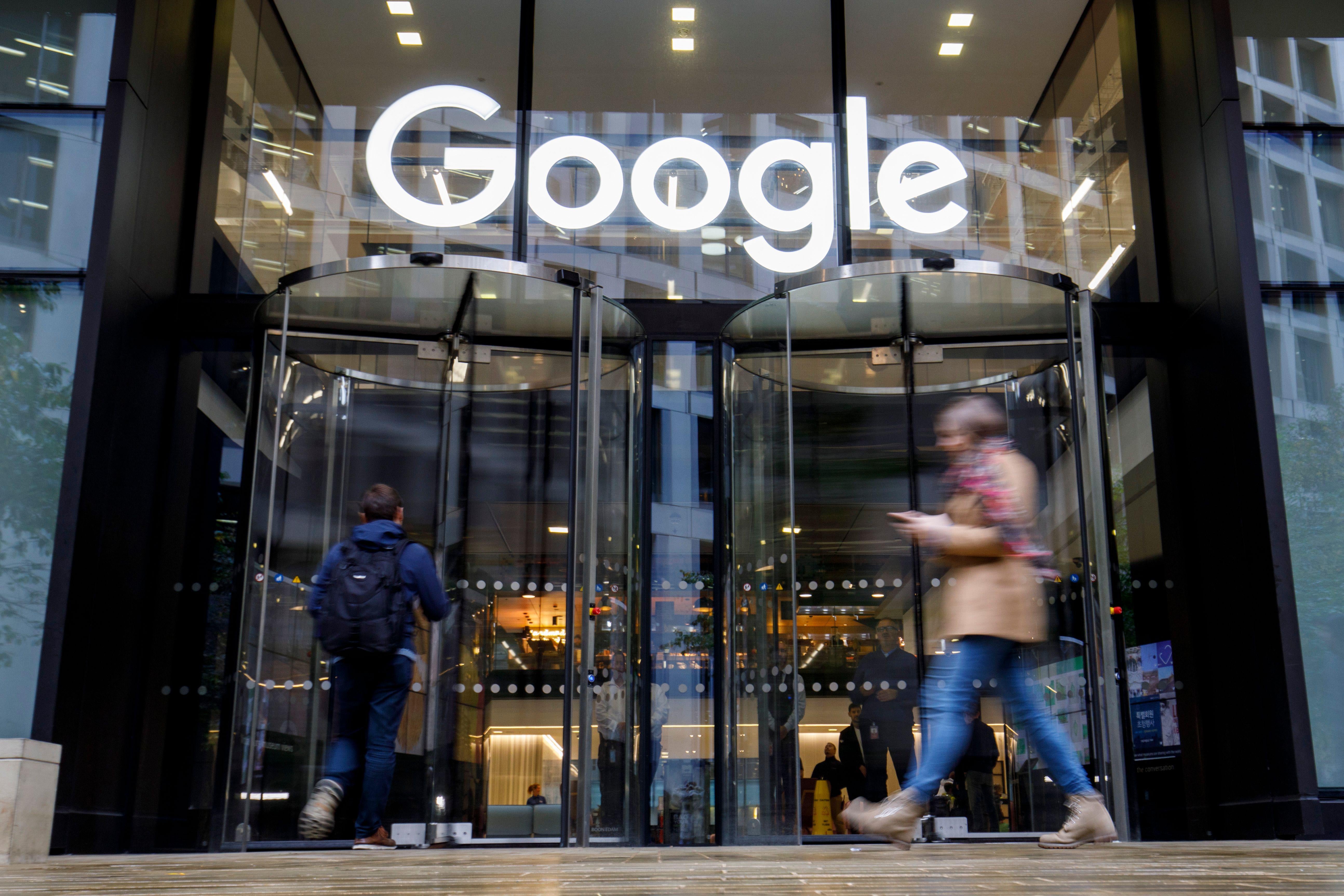 People walk past Google's U.K. headquarters in London on Nov. 1, 2018.