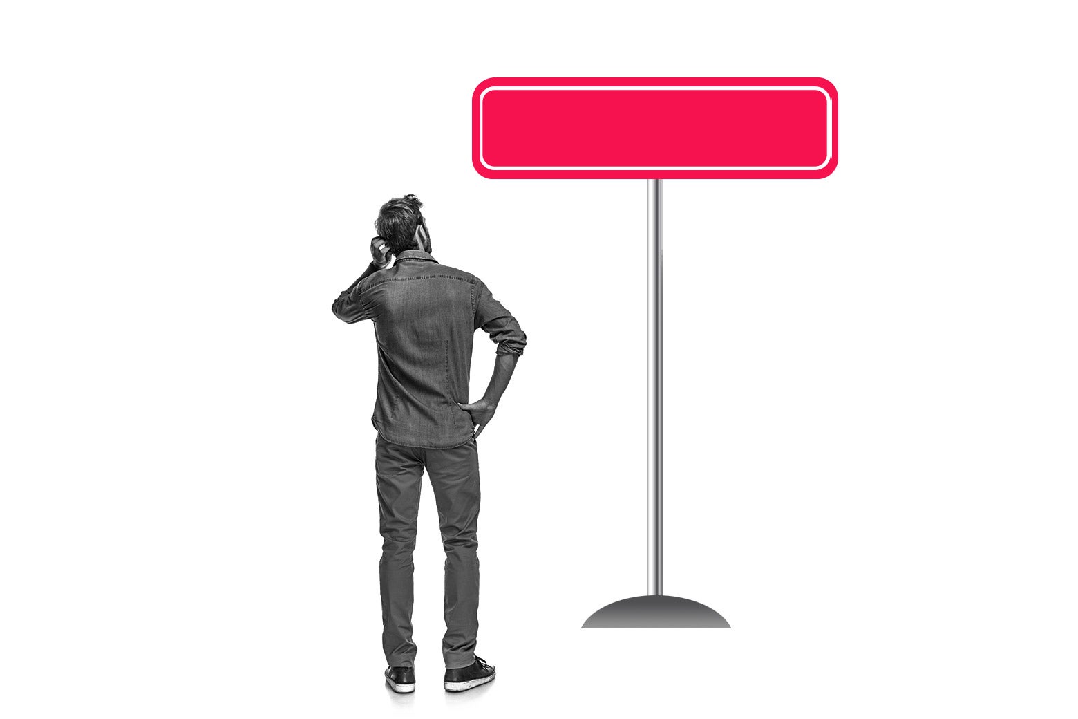Man staring at an empty street sign.