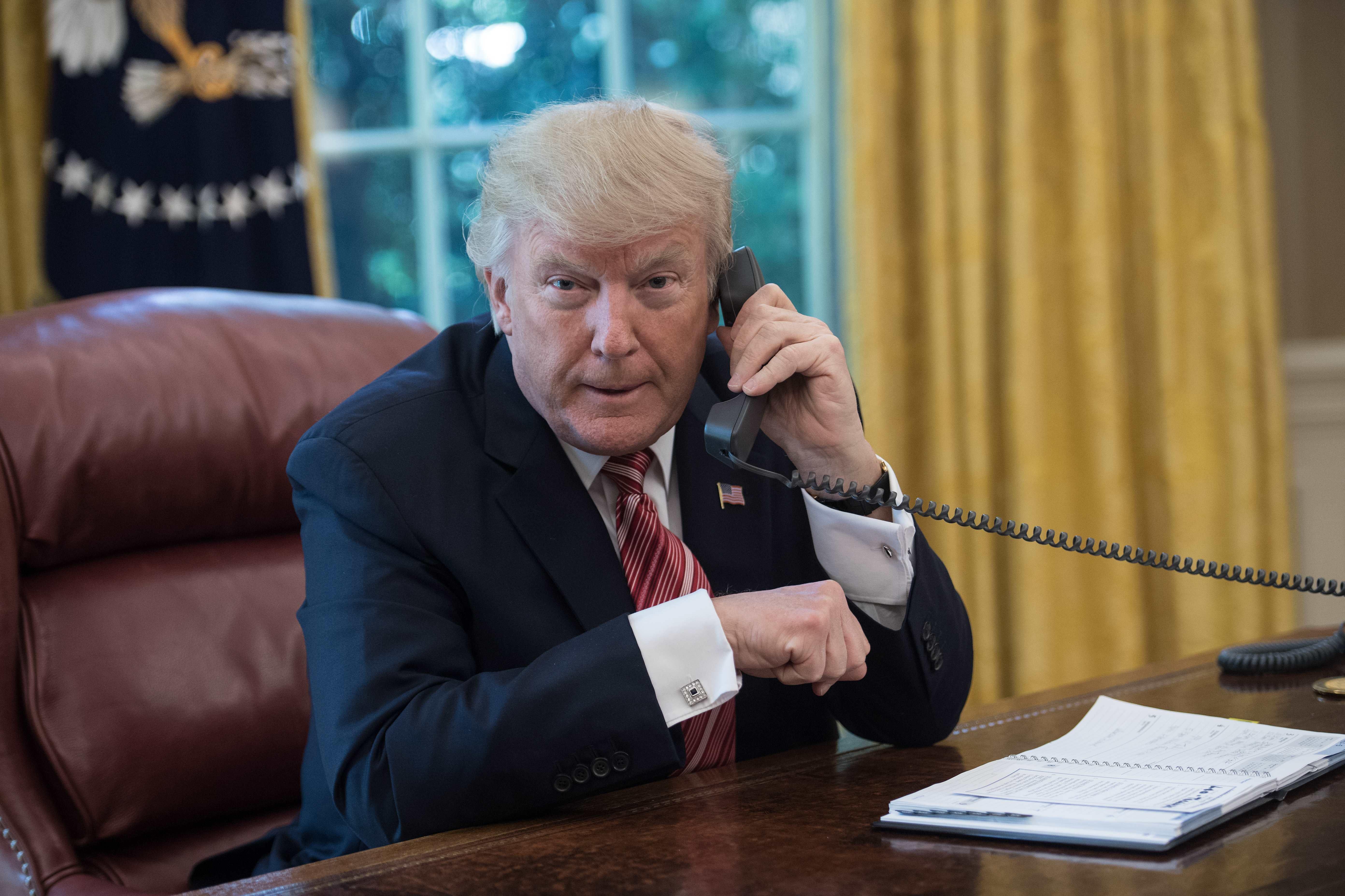 President Trump on the phone in the Oval Office at the White House in Washington, DC, on June 27, 2017.