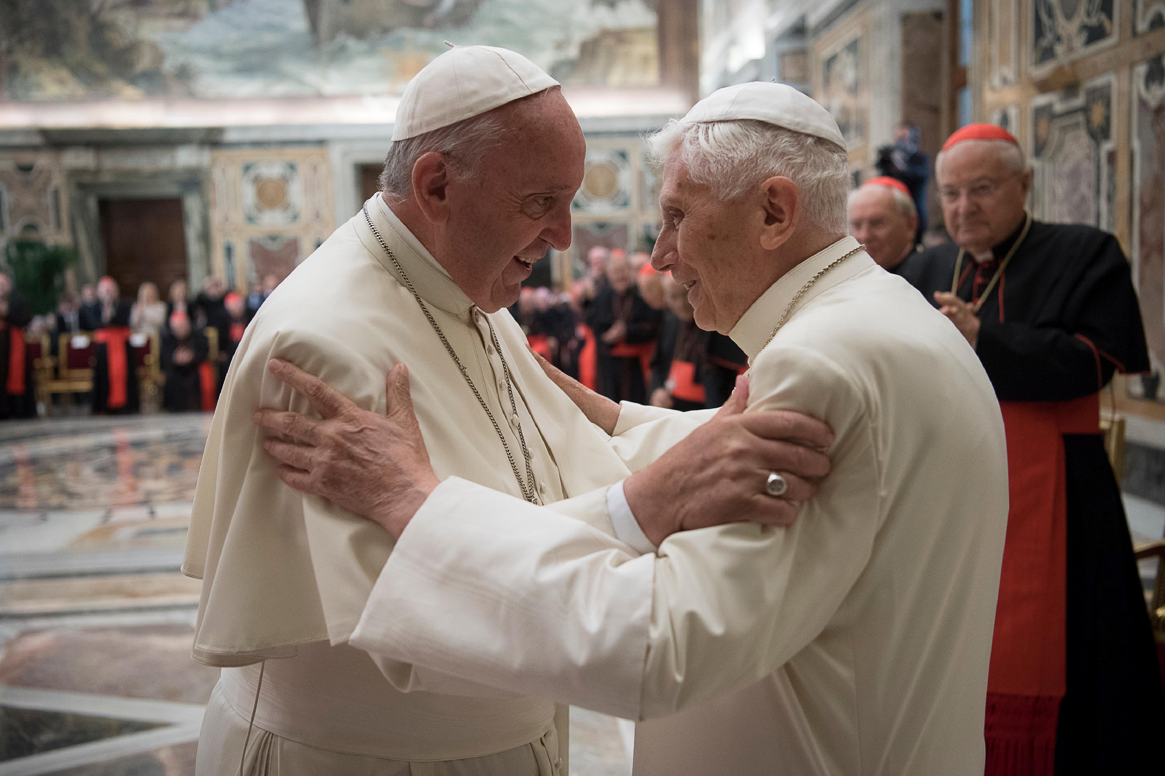 The two popes embrace.
