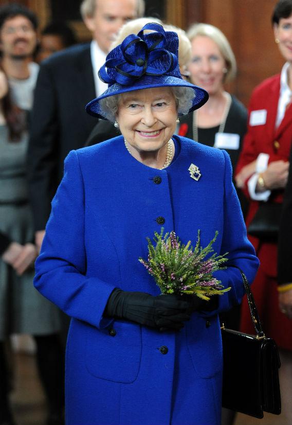 Queen Elizabeth II dressed in blue.