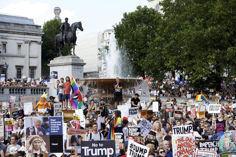 Protesters against the U.K. visit of U.S. President Donald Trump gather in Trafalgar Square after taking part in a march in London.
