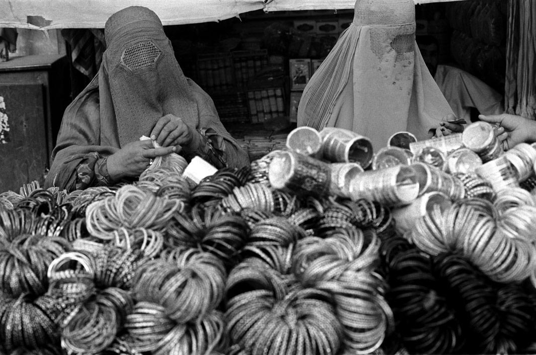 Women shopping for bangles at a bazaar in Kandahar. August 2004