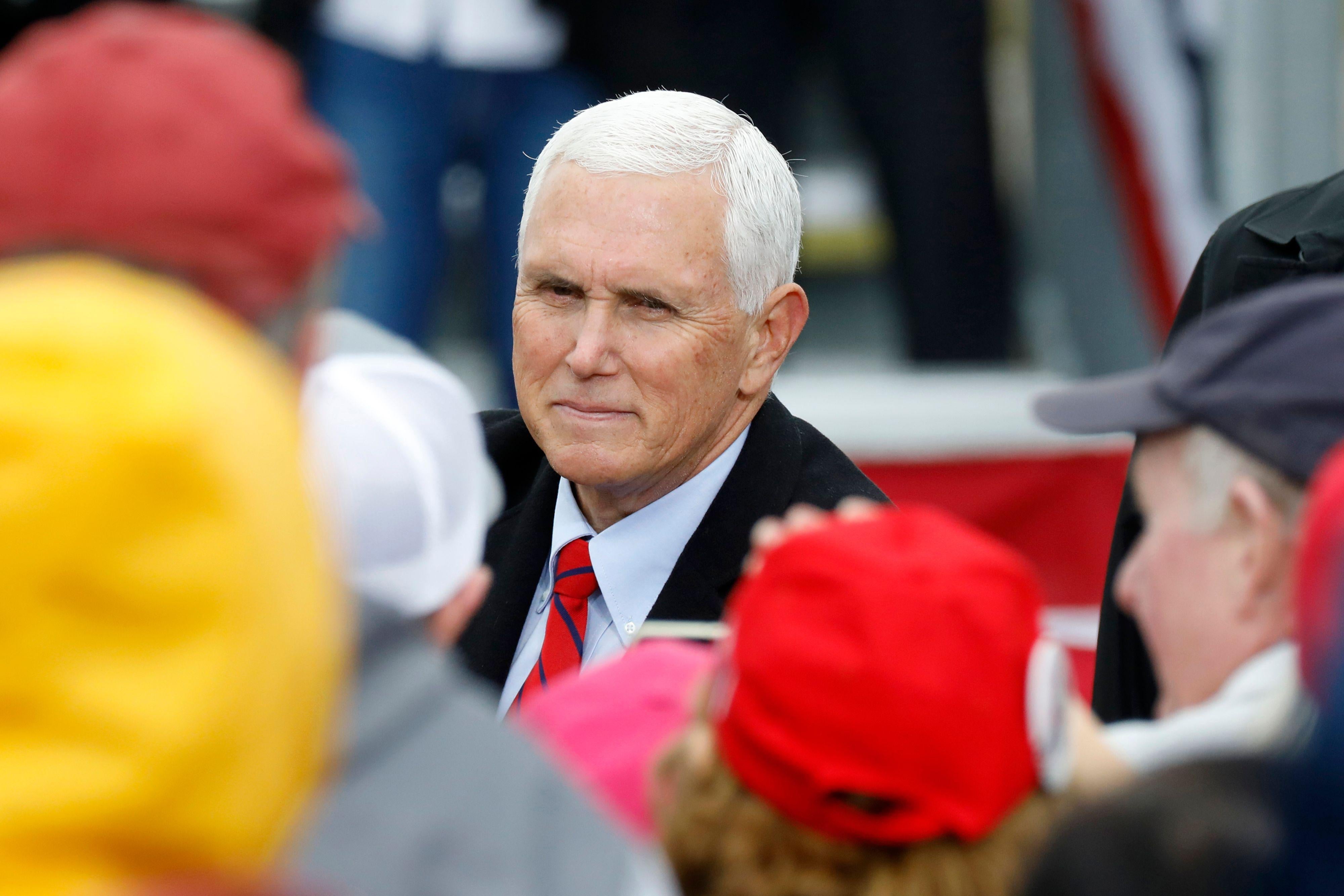 Vice President Mike Pence greets supporters after a campaign event at Oakland County International Airport in Waterford, Michigan, on October 22, 2020.
