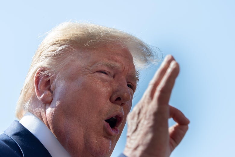 Donald Trump makes the OK sign.