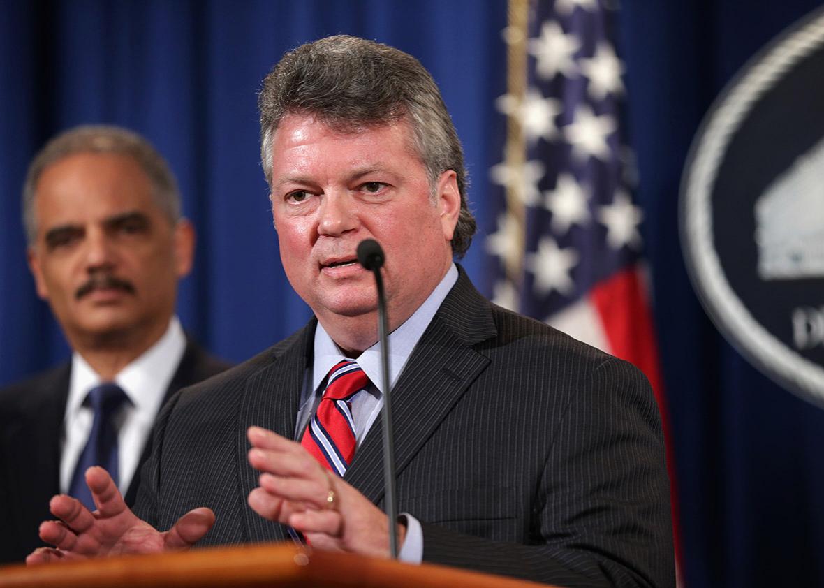 Mississippi Attorney General Jim Hood (R) speaks as U.S. Attorney General Eric Holder.