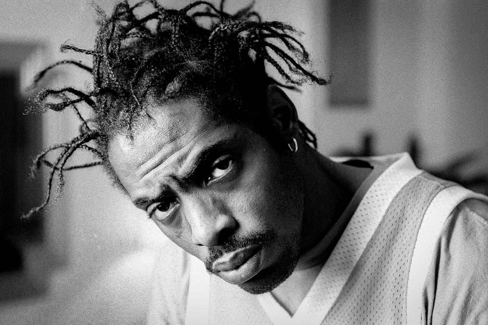 A black-and-white photo shows him just as you remember him, his braids emerging in twists from his head, his eyes piercing, as he stares at the viewer