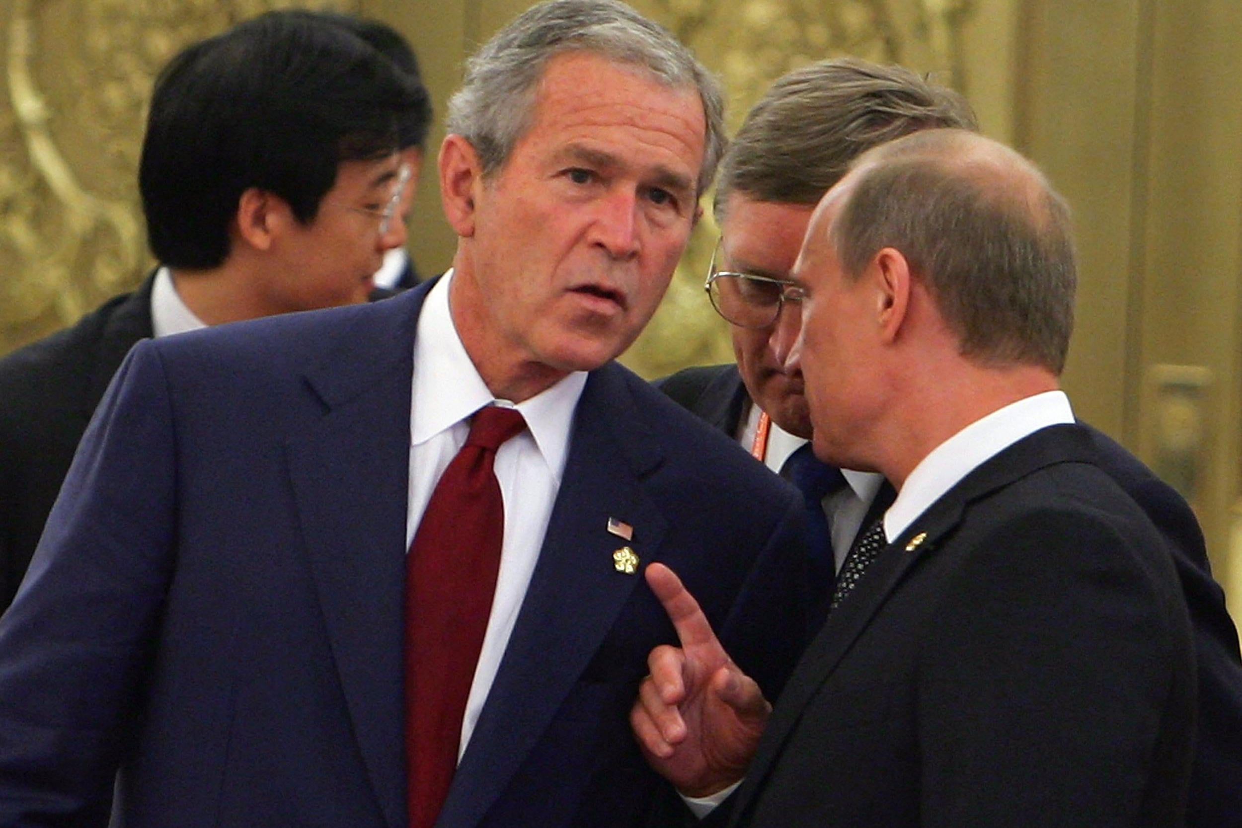 Bush leans in and looks like he's getting played by Putin.