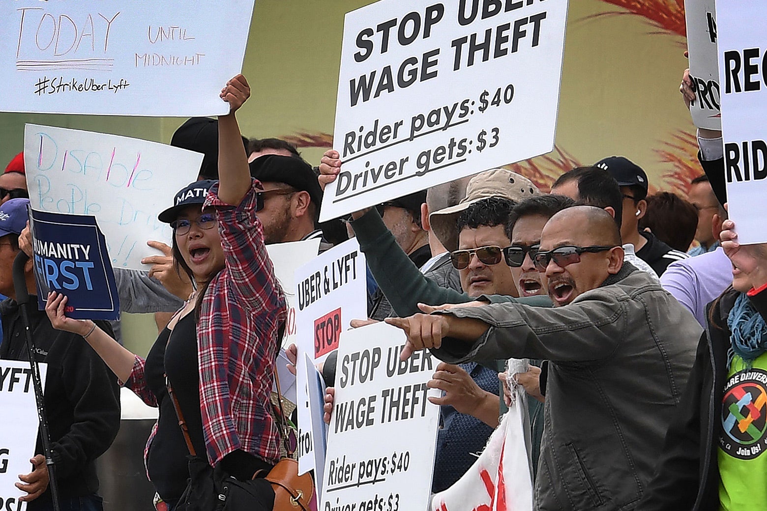 Drivers for Uber and Lyft stage a strike and protest at the LAX International Airport.
