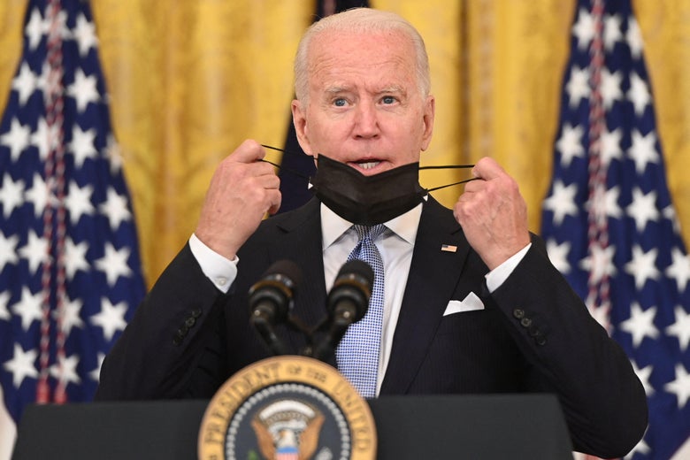 President Joe Biden takes off his face mask before speaking about Covid vaccinations in the East Room of the White House in Washington, D.C. on July 29, 2021. 