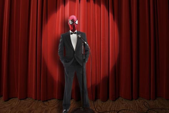 Spiderman on a stage in a tux