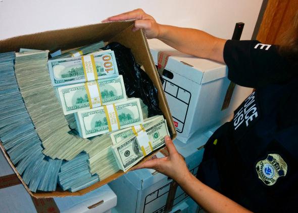 Money seized during a raid in Los Angeles, Sept. 10, 2014.