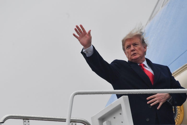 President Trump waves as he boards Air Force One.