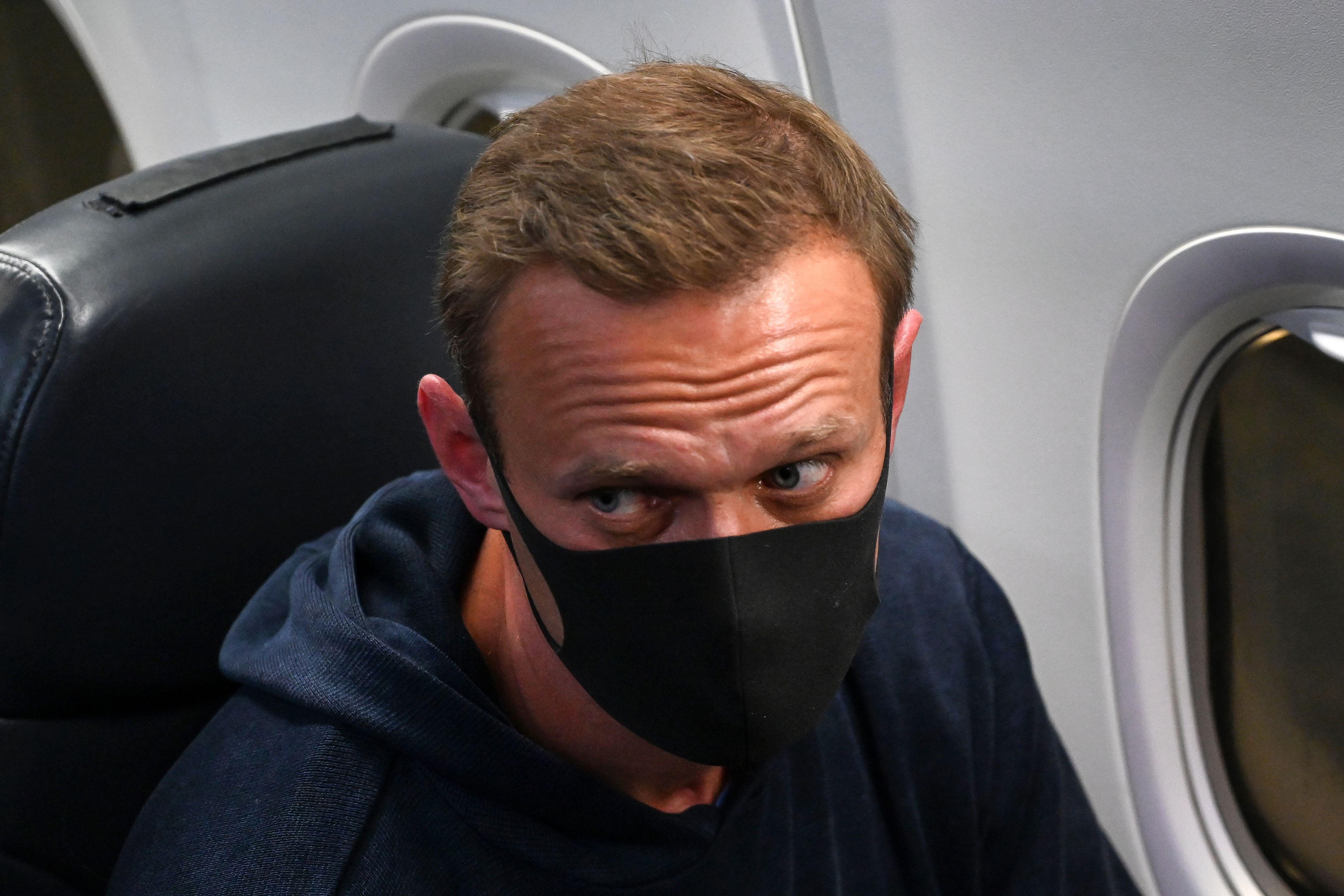 Russian opposition leader Alexei Navalny is seen in a Pobeda plane after it landed at Moscow's Sheremetyevo airport on January 17, 2021.