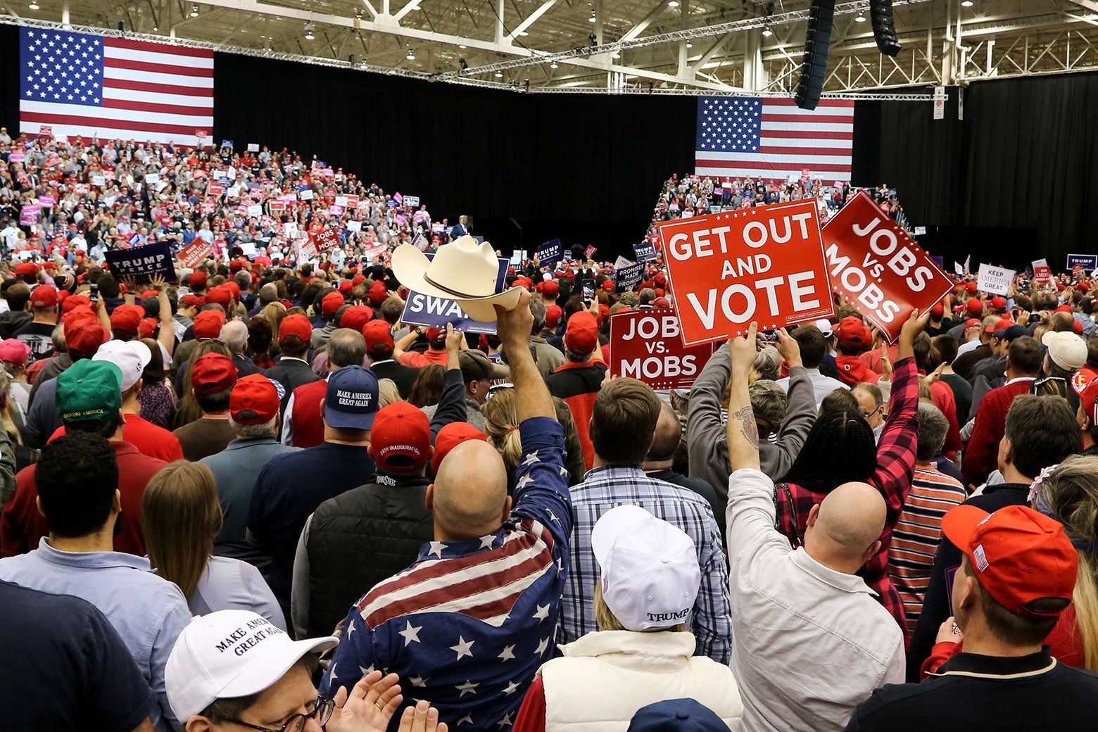 Supporters of U.S. President Donald Trump listen to the president speak at his rally in support of Ohio Republican candidates on Nov. 5 in Cleveland.