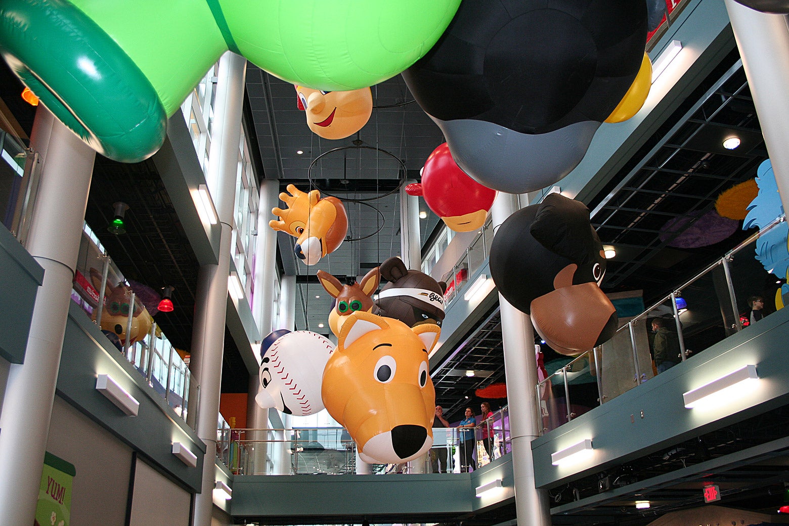 Mascot balloons hanging from the ceiling at the Mascot Hall of Fame.