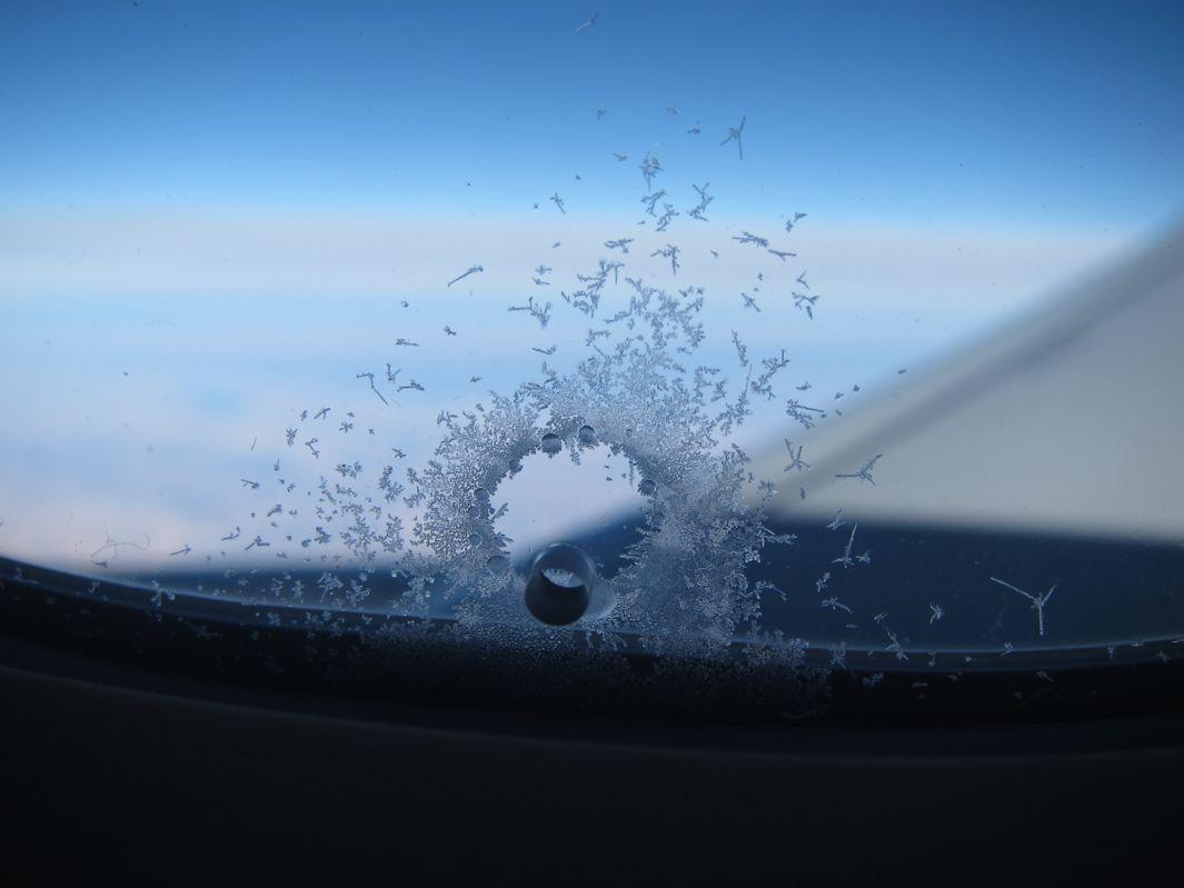 The Airplane window ice ring