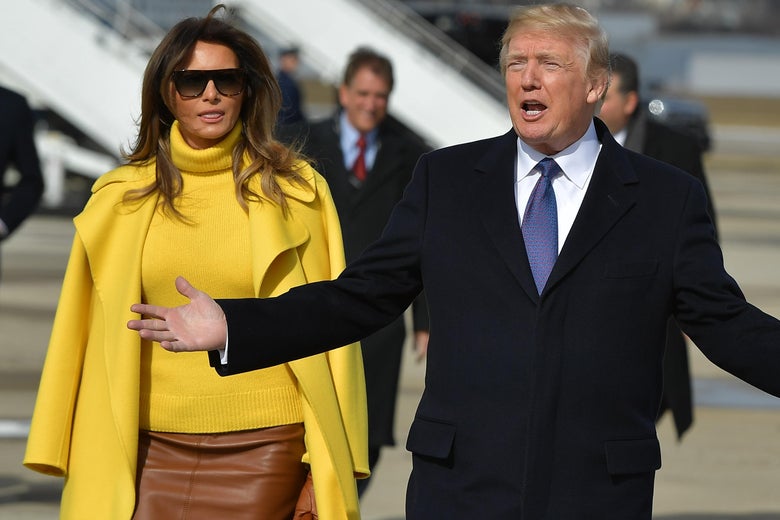 US President Donald Trump and First Lady Melania Trump walk across the tarmac to greet supporters upon arrival at Cincinnati Municipal Lunken Airport in Cincinnati on February 5, 2018. / AFP PHOTO / MANDEL NGAN        (Photo credit should read MANDEL NGAN/AFP/Getty Images)