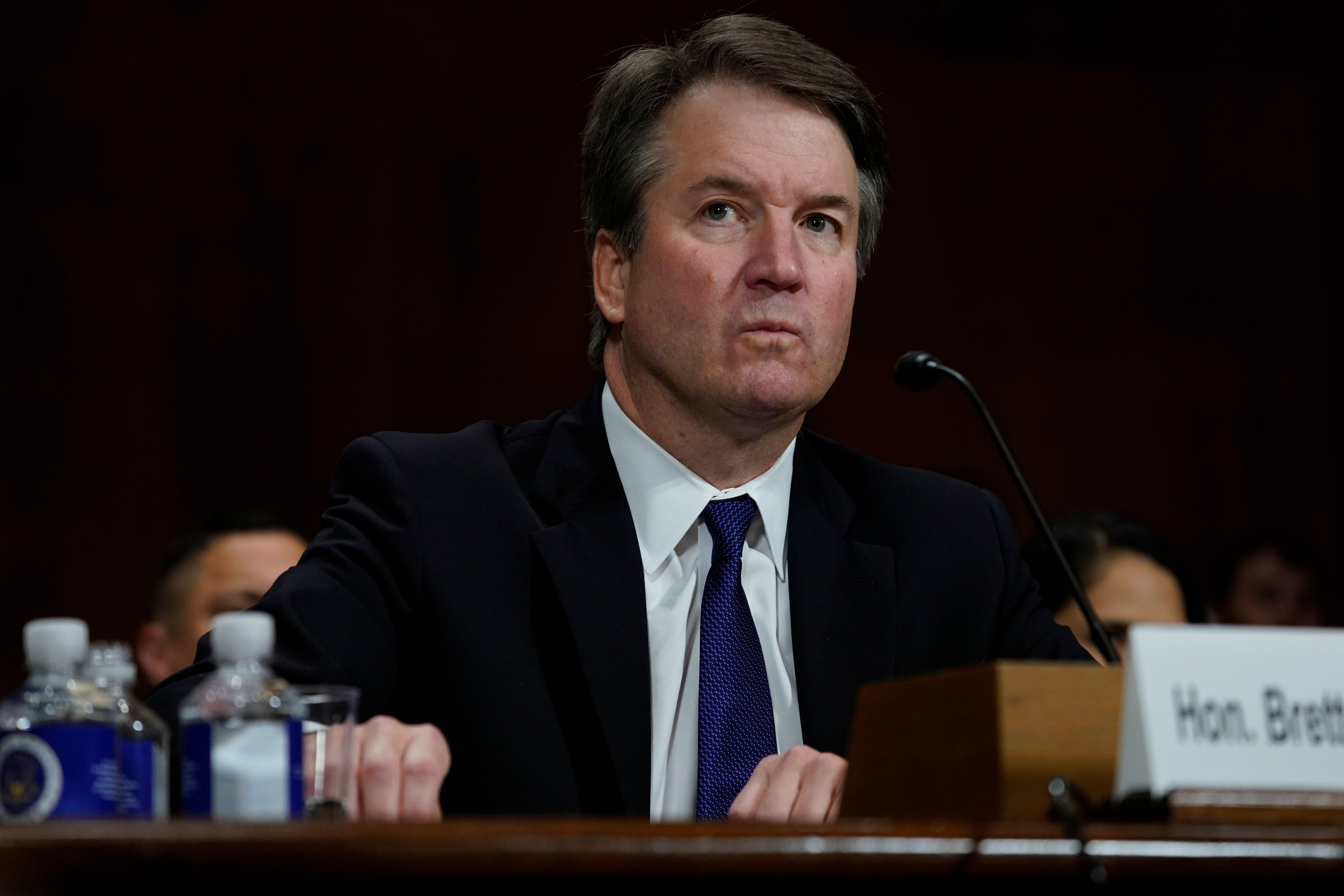Supreme court nominee Brett Kavanaugh looks frustrated while sitting before the committee.