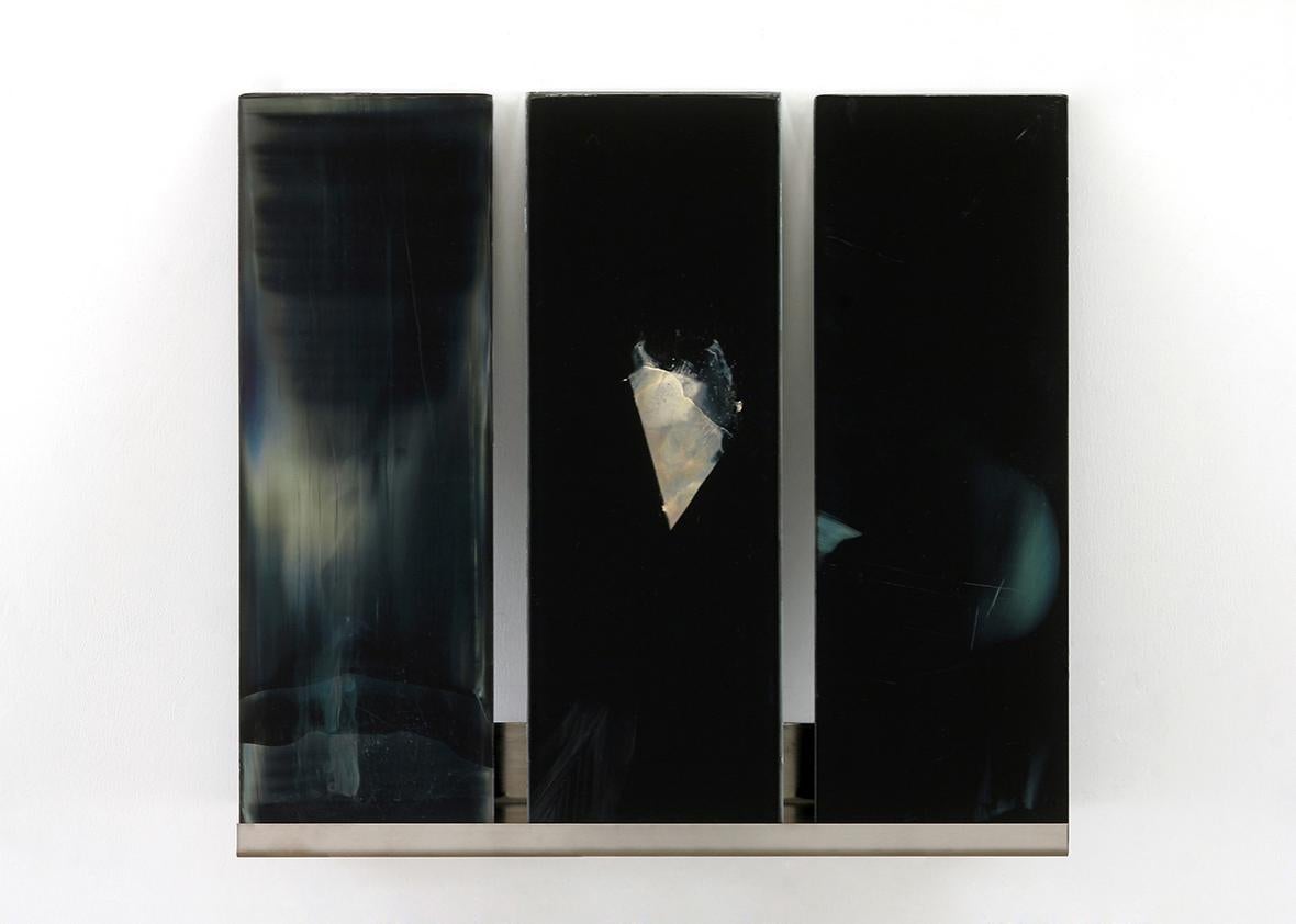 Visible Signs of Indeterminate Meaning 14. Silver nanoparticle paint and silver mirroring on glass. 12 x 15.5 inches, 2015. These small works on glass are created with silver nanoparticles Nichols synthesizes and with Victorian-era silver mirroring techniques. Visible Signs of Indeterminate Meaning is the product of carefully planned measurements, calculations, and titrations in a chemistry lab and of spontaneous smears, spills, and erasures in the artist's painting studio.