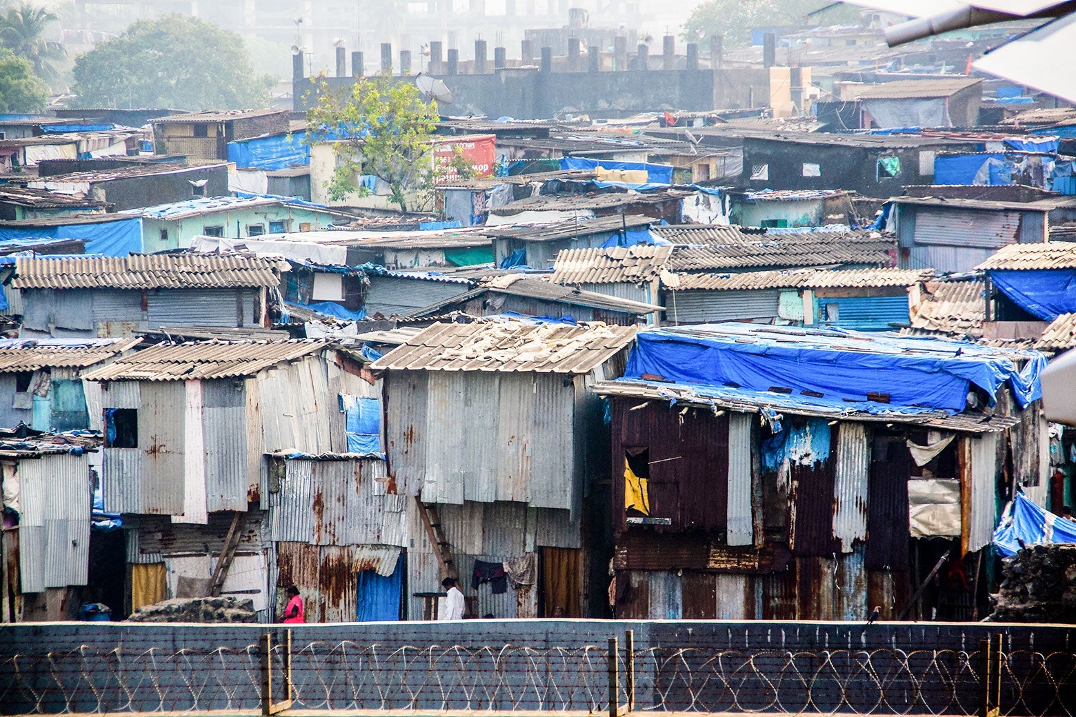 A view of huts and hanging clothes in a slum