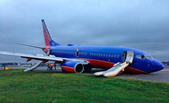 A Southwest Boeing 737 aeroplane sits on the tarmac after passengers were evacuated, at LaGuardia Airport in New York, in this photo courtesy of the National Transportation Safety Board (NTSB) made available July 23, 2013.