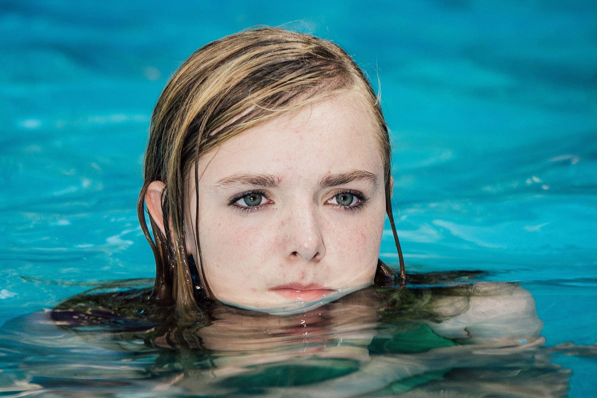 A teenage girl in a swimming pool.