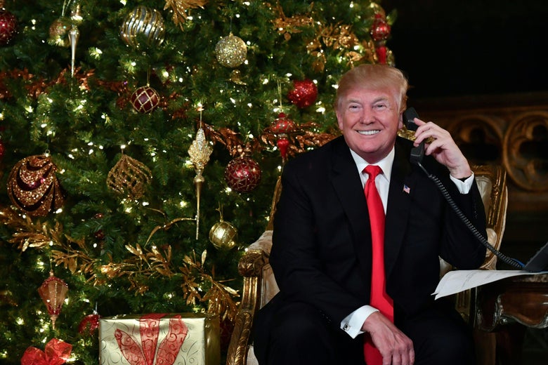 US President Donald J. Trump speaks on the phoneat his Mar-a-Lago resort in Palm Beach, Florida on December 24, 2017.  