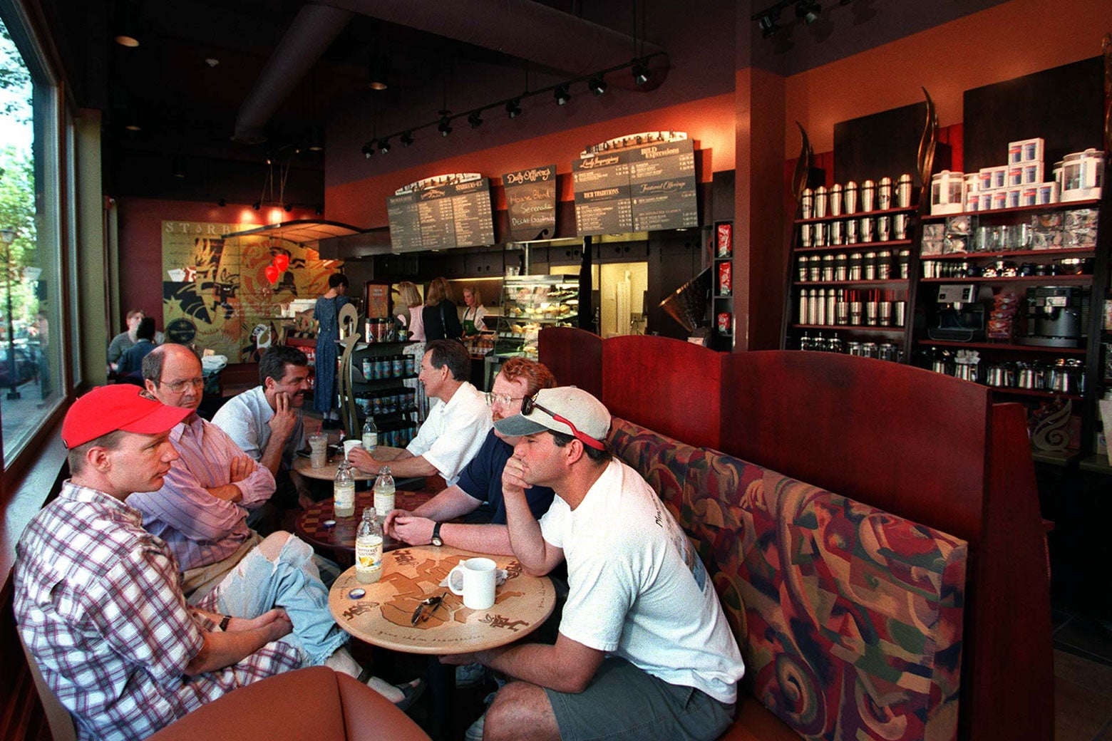 A 1990s Starbucks is very brown and burgundy and is dominated by very large, plush booth seating. 
