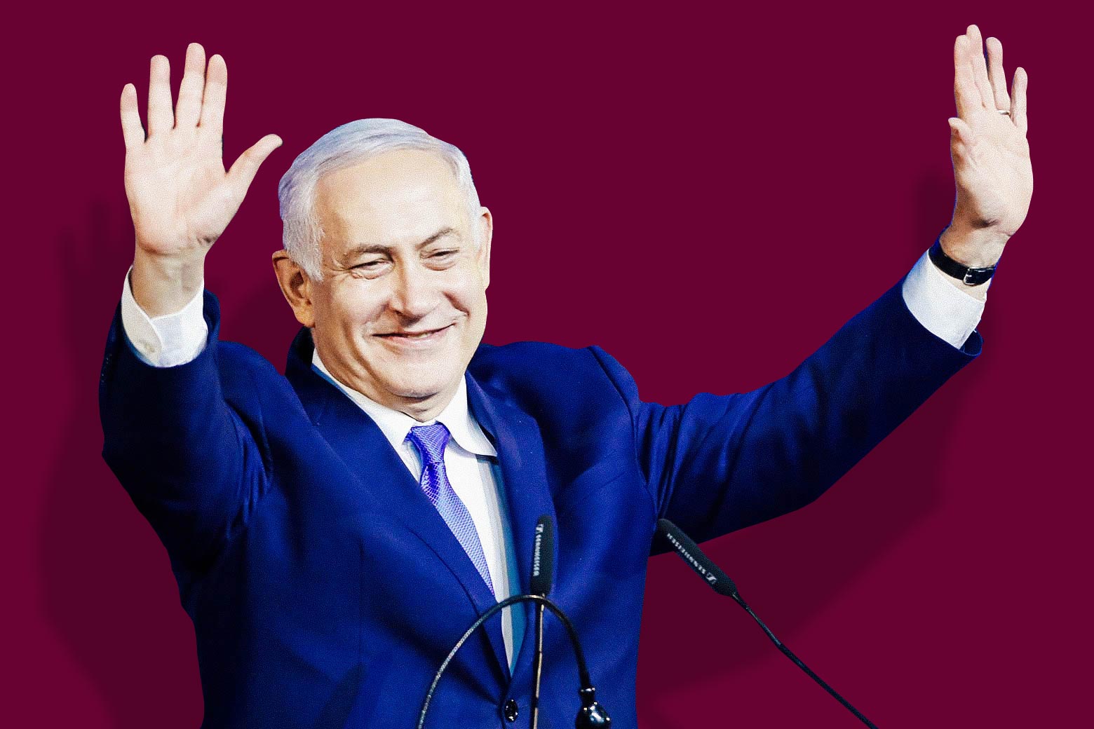 Israeli Prime Minister Benjamin Netanyahu with arms raised