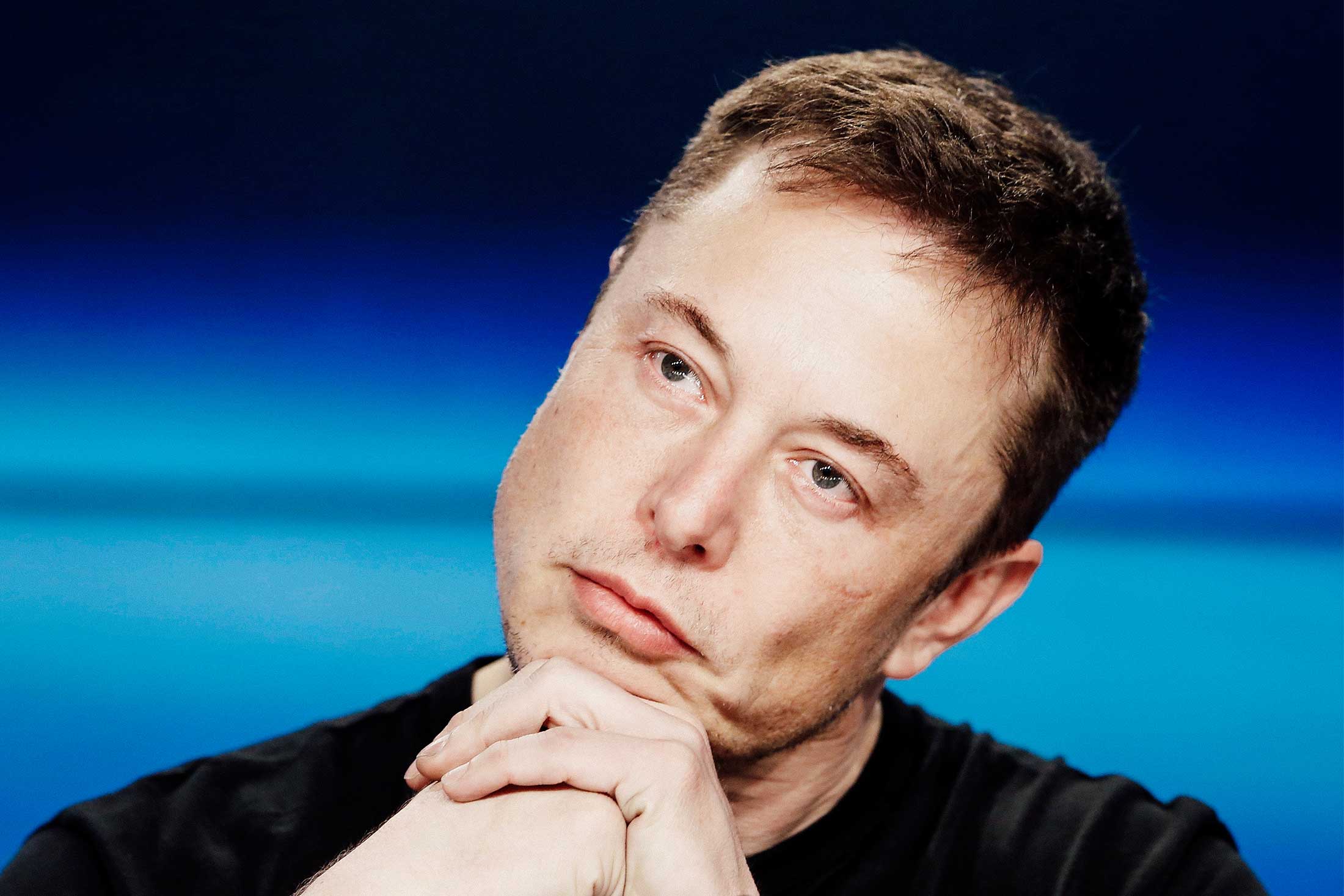 Elon Musk listens at a press conference following the first launch of a SpaceX Falcon Heavy rocket at the Kennedy Space Center in Cape Canaveral, Florida, on Feb. 6.