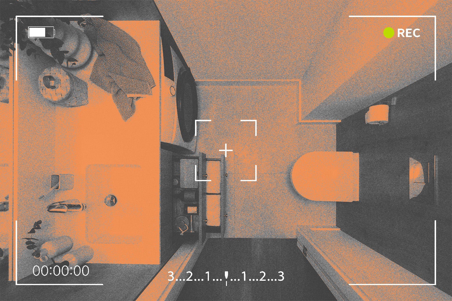 An empty bathroom seen overhead through what looks like a security camera