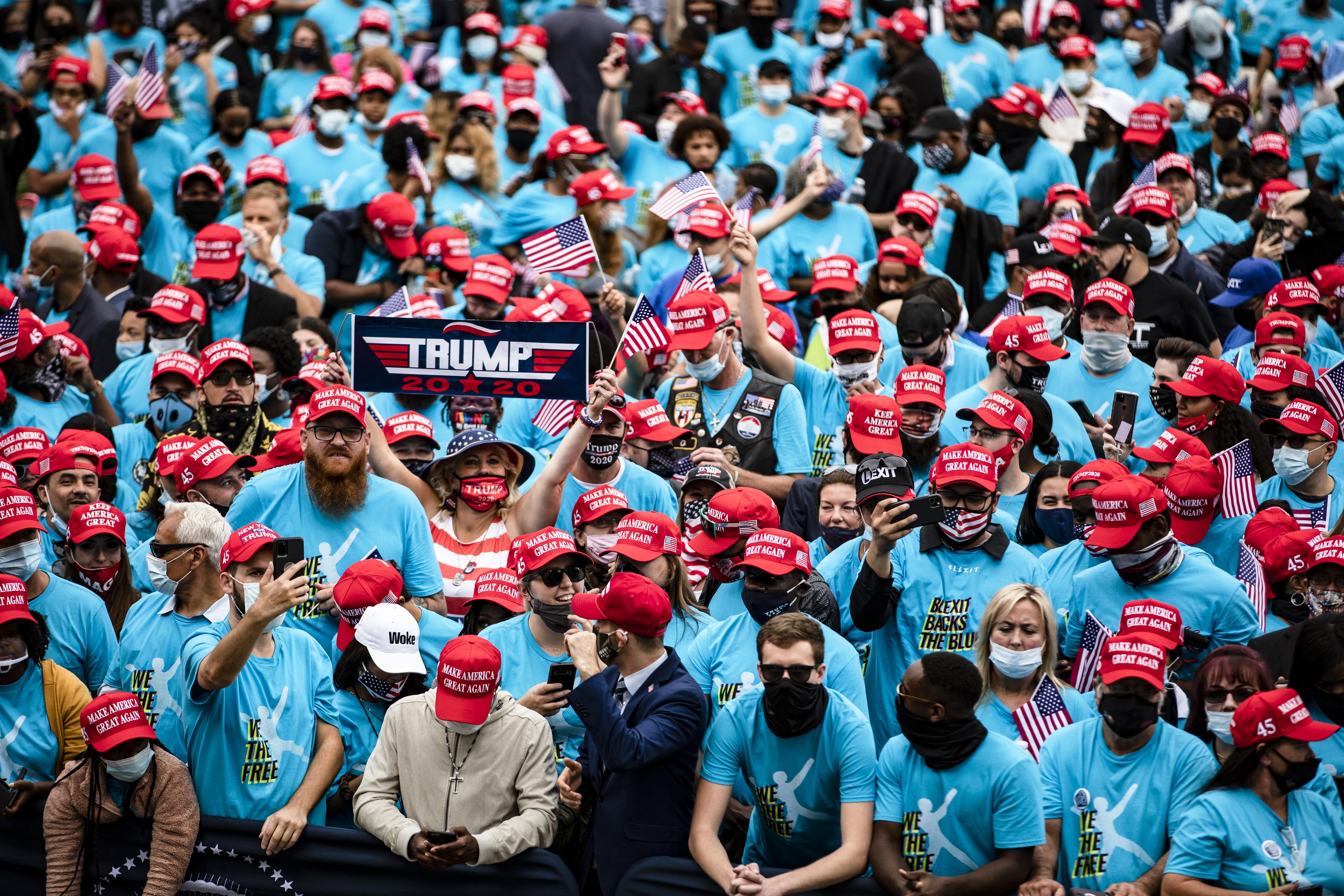 Supporters cheer as they wait for President Donald Trump to address a rally in support of law and order on the South Lawn of the White House on October 10, 2020 in Washington, D.C.