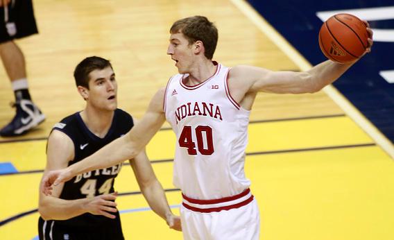 Indiana University forward Cody Zeller (40) holds the basketball while being defended by Butler University center Andrew Smith during the first half of their NCAA basketball game in Indianapolis December 15, 2012.