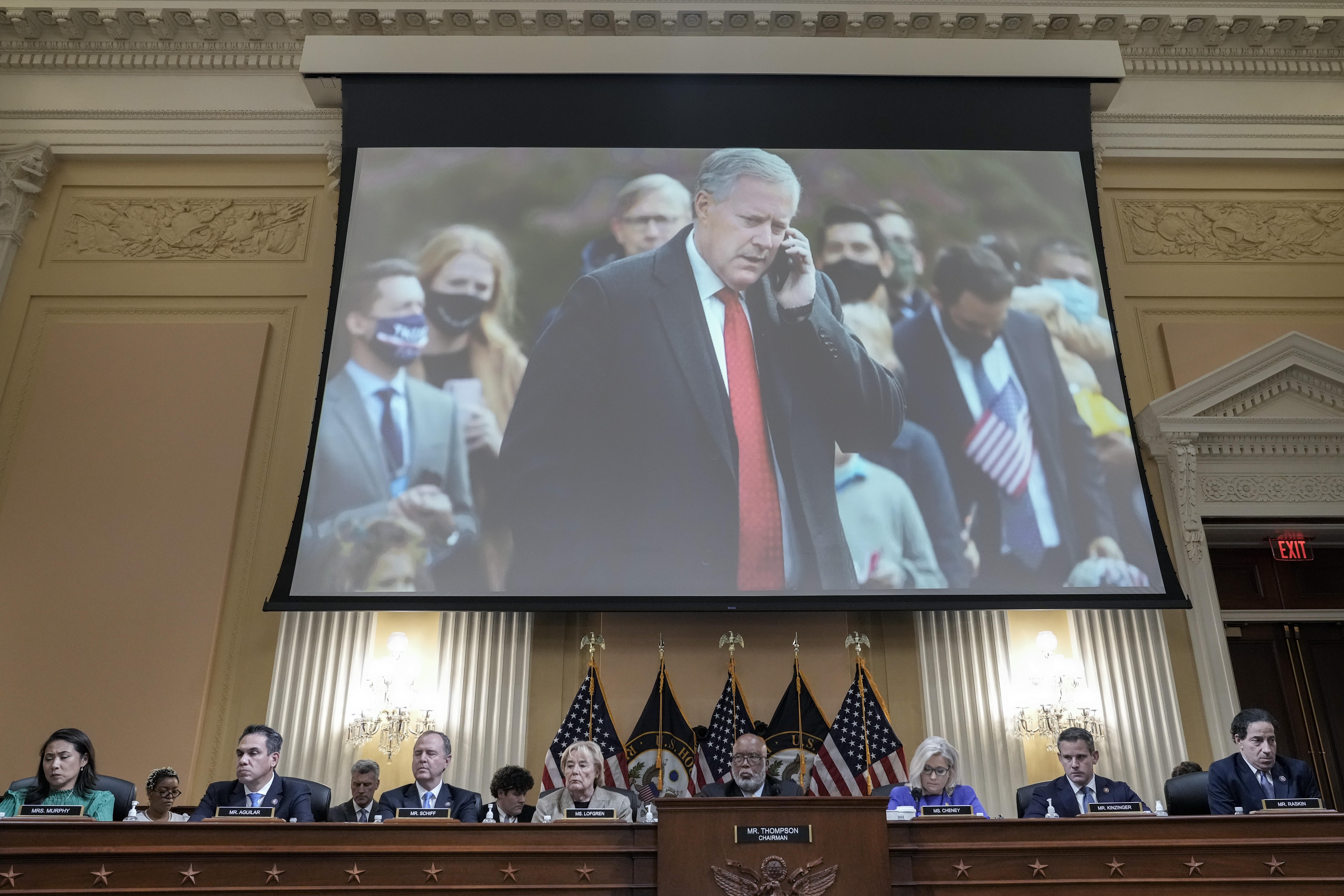 Mark Meadows displayed on a screen above the dais where members of the select committee sit.