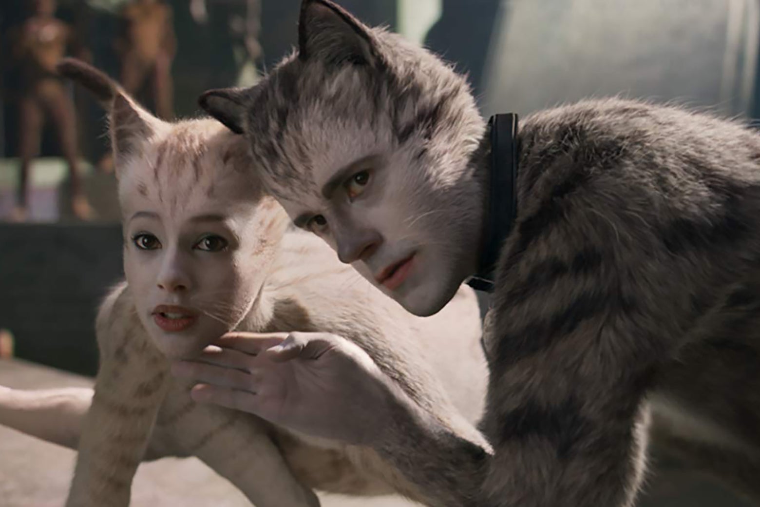Francesca Hayward and Robbie Fairchild in a still from Cats. The actors' images have been CGI'ed into uncanny looking cats.