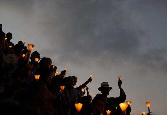 People held candles during a praying ceremony for the health of Venezuelan President Hugo Chavez in Caracas Feb. 22, 2013. 